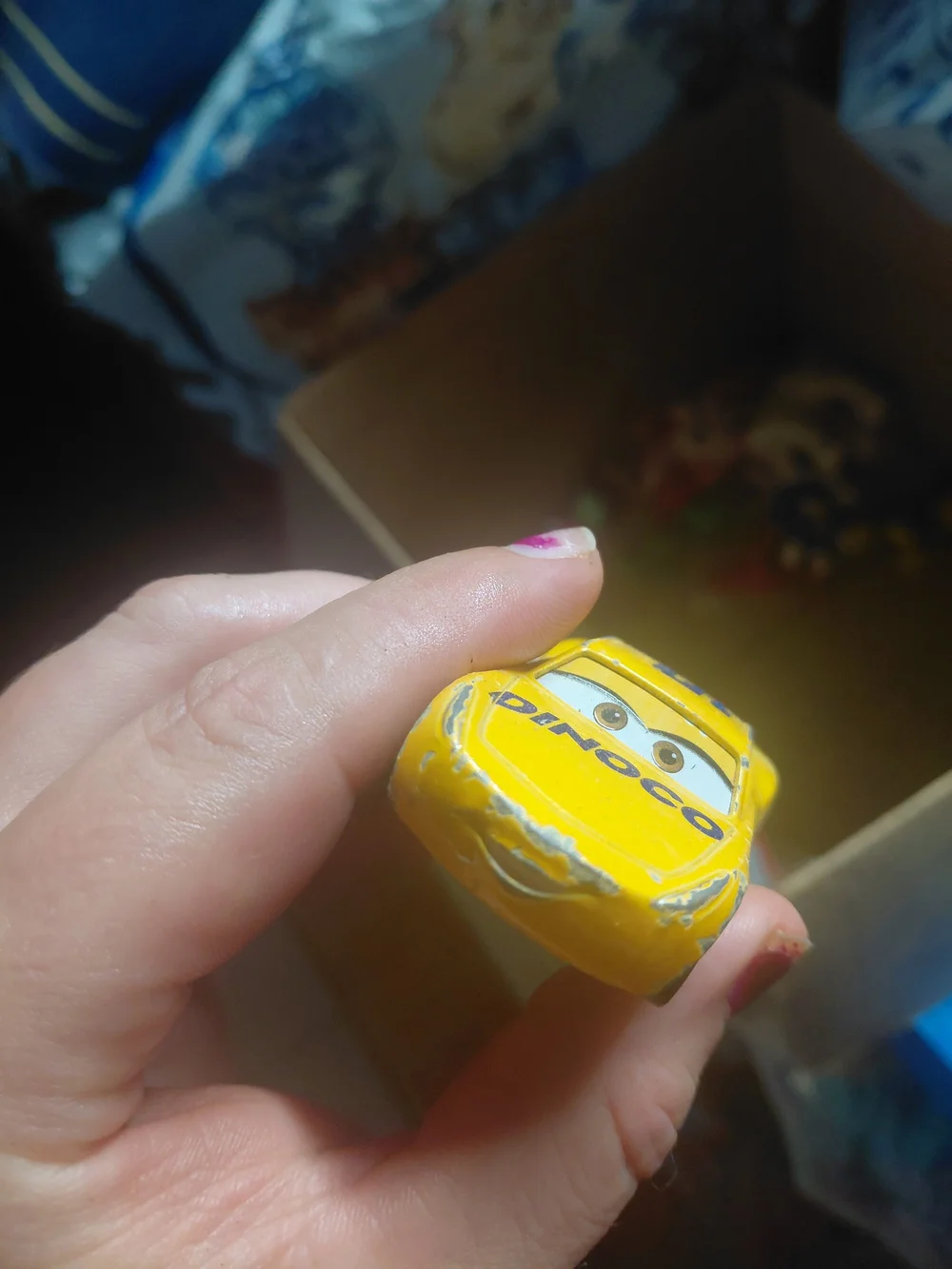 Disney Pixar Cars Cruz Ramirez die-cast toy car in her yellow Dinoco racing live
